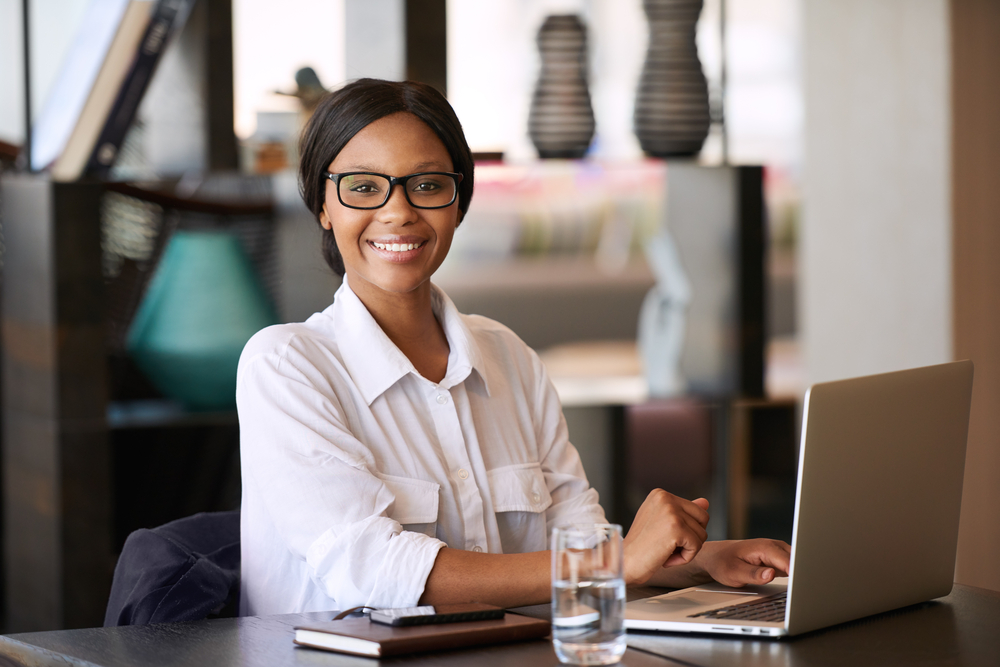 Smiling Business Woman with Laptop