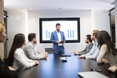 Man giving presentation to associates